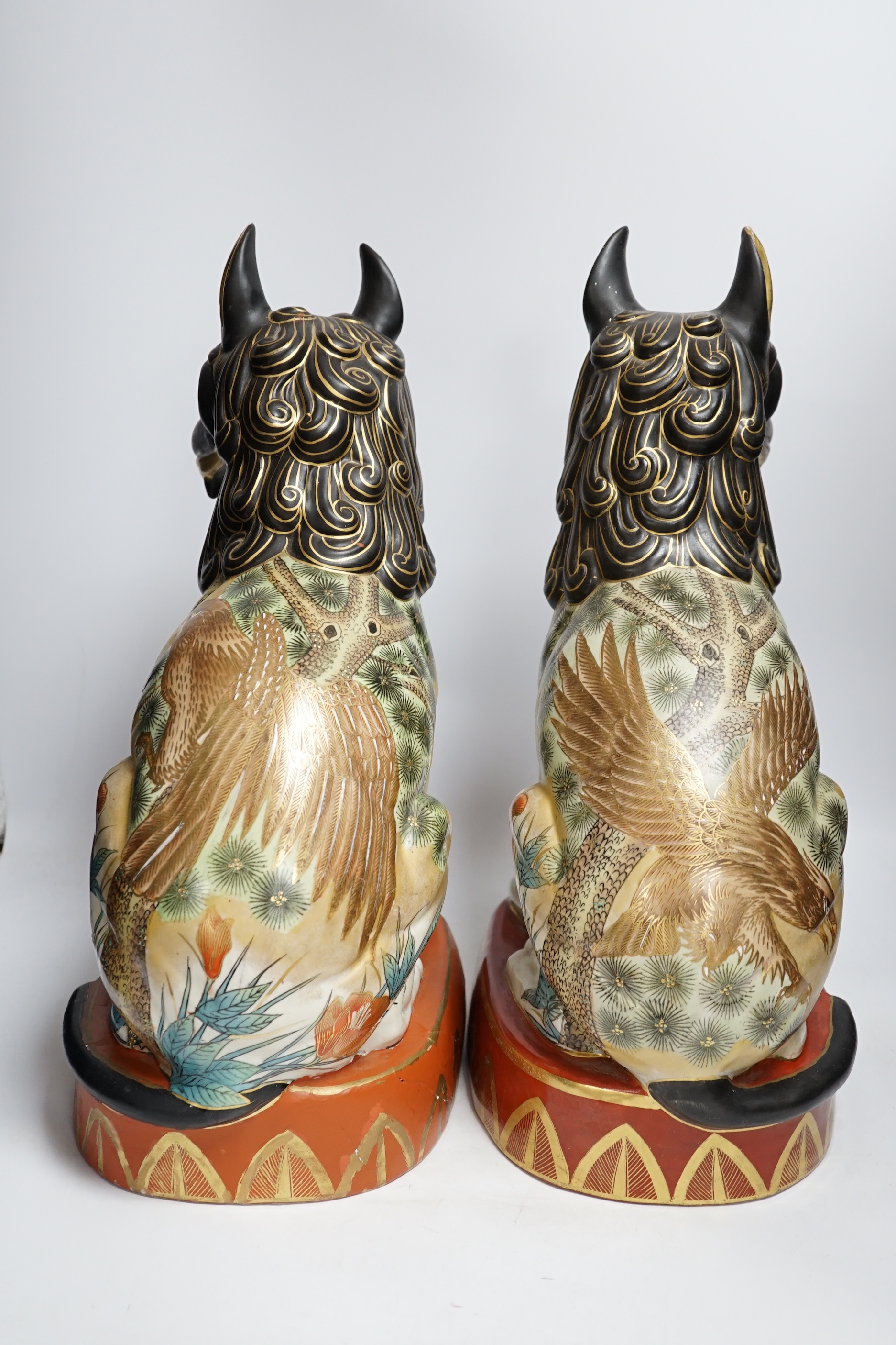 A pair of Chinese Macau porcelain lion dogs, 43cm